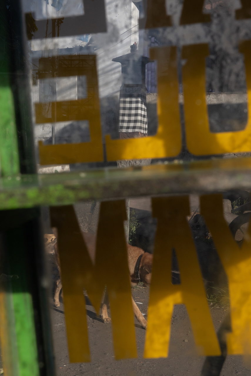 Yellow letters across checked cloth and a green frame.