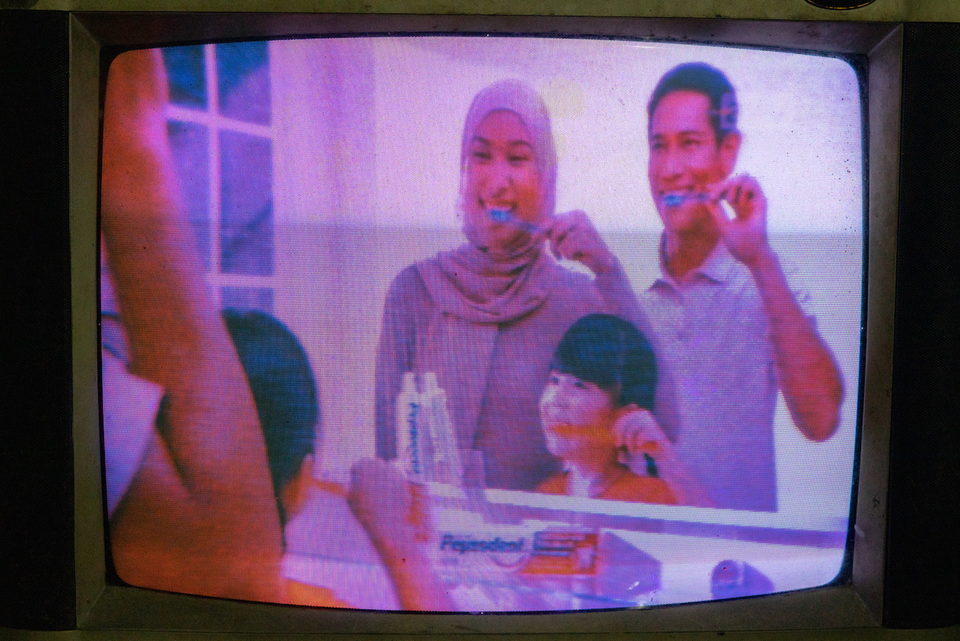 A television advertisement of people brushing their teeth.