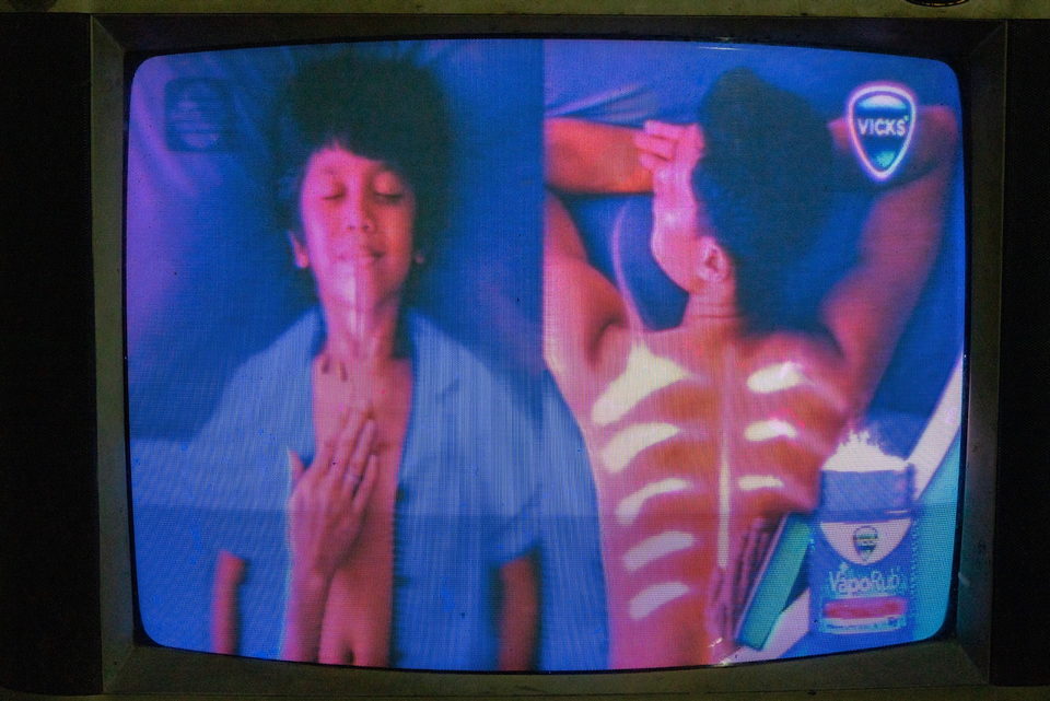 A television advertisement showing a child and a bottle.